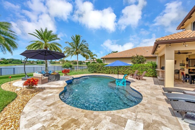 5014 Manchia Dr, Lake Worth, FL 33463 - view of swimming pool featuring a patio area, a fenced backyard, an outdoor hangout area, and ceiling fan