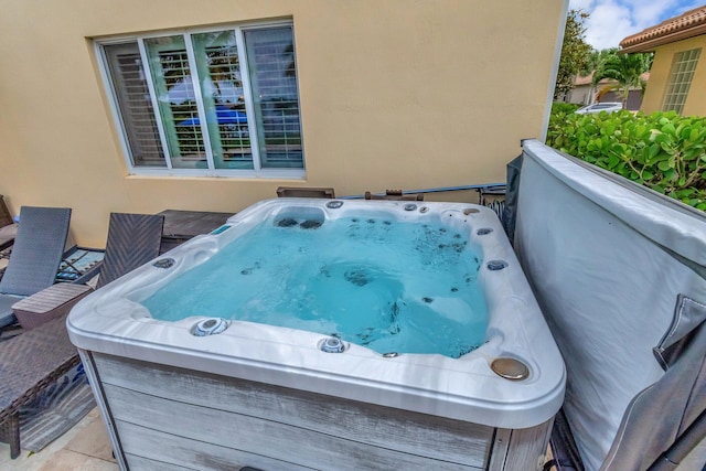 5014 Manchia Dr, Lake Worth, FL 33463 - view of patio / terrace featuring a hot tub