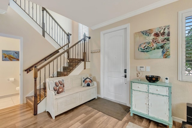 5014 Manchia Dr, Lake Worth, FL 33463 - entryway featuring light wood-style floors, plenty of natural light, crown molding, and stairway