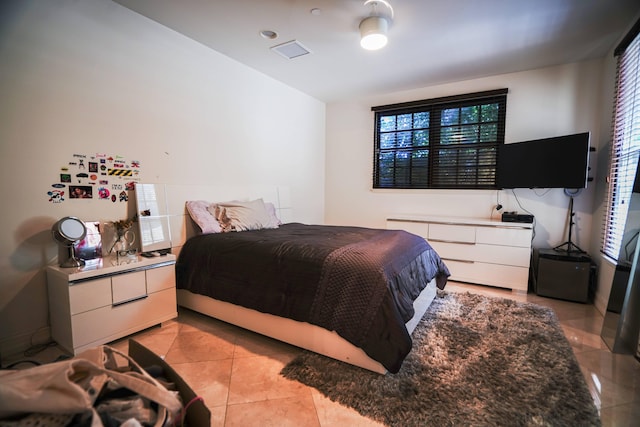 65 NE 4th Ave Unit I, Delray Beach, FL 33483 - bedroom with light tile patterned flooring and multiple windows