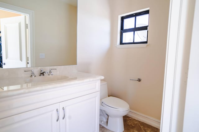 65 NE 4th Ave Unit I, Delray Beach, FL 33483 - half bathroom featuring vanity, toilet, baseboards, and tile patterned flooring