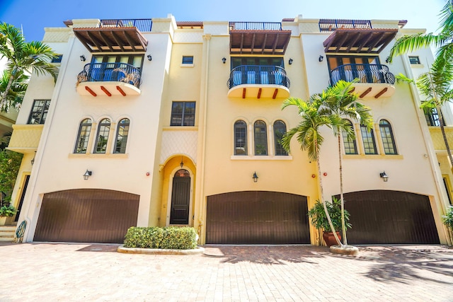 65 NE 4th Ave Unit I, Delray Beach, FL 33483 - view of property with an attached garage and decorative driveway