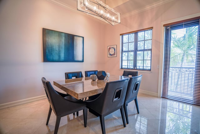 65 NE 4th Ave Unit I, Delray Beach, FL 33483 - dining area featuring ornamental molding, light tile patterned flooring, baseboards, and a chandelier