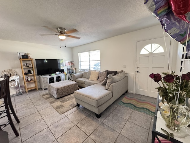 308 Florida Ave, Winter Garden, FL 34787 - living area featuring ceiling fan, a textured ceiling, and light tile patterned floors