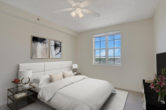 616 Clearwater Park Rd Unit 812, West Palm Beach, FL 33401 - bedroom with carpet floors, baseboards, ceiling fan, and a textured ceiling