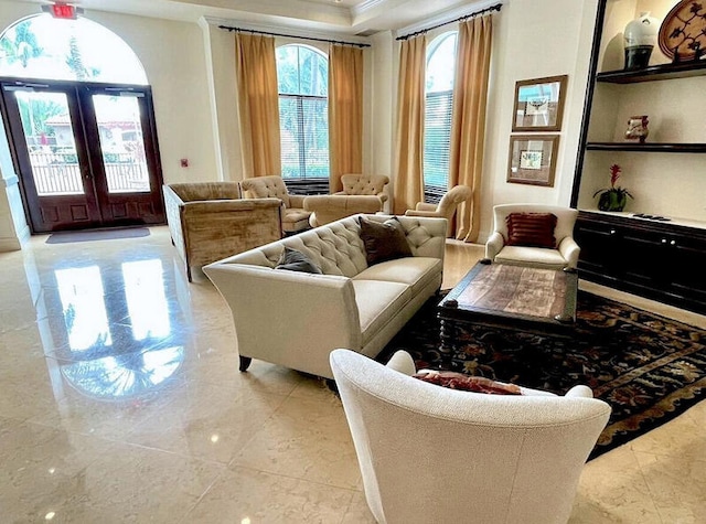 616 Clearwater Park Rd Unit 812, West Palm Beach, FL 33401 - living area with french doors, crown molding, and built in shelves