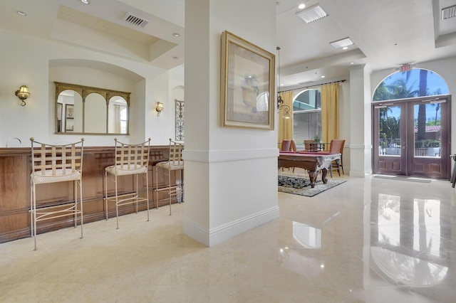 616 Clearwater Park Rd Unit 812, West Palm Beach, FL 33401 - bathroom featuring a raised ceiling, healthy amount of natural light, french doors, and recessed lighting