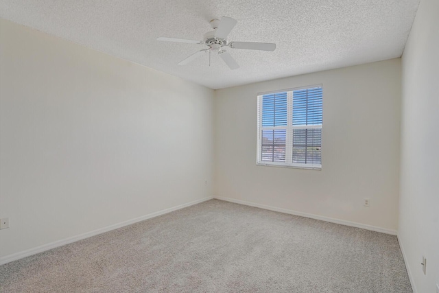 616 Clearwater Park Rd Unit 812, West Palm Beach, FL 33401 - spare room with carpet, a textured ceiling, ceiling fan, and baseboards