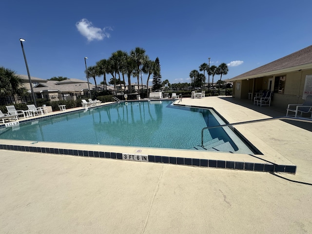 1021 Abada Ct NE Unit 106, Palm Bay, FL 32905 - community pool featuring a patio area