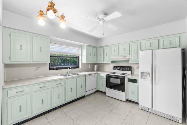 4657 Greentree Pl Unit A, Boynton Beach, FL 33436 - kitchen featuring white appliances, under cabinet range hood, a sink, light countertops, and light tile patterned floors