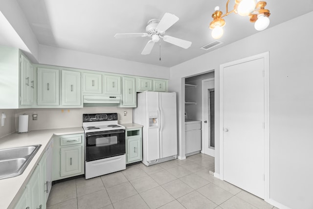 4657 Greentree Pl Unit A, Boynton Beach, FL 33436 - kitchen featuring white appliances, under cabinet range hood, a sink, light countertops, and light tile patterned floors