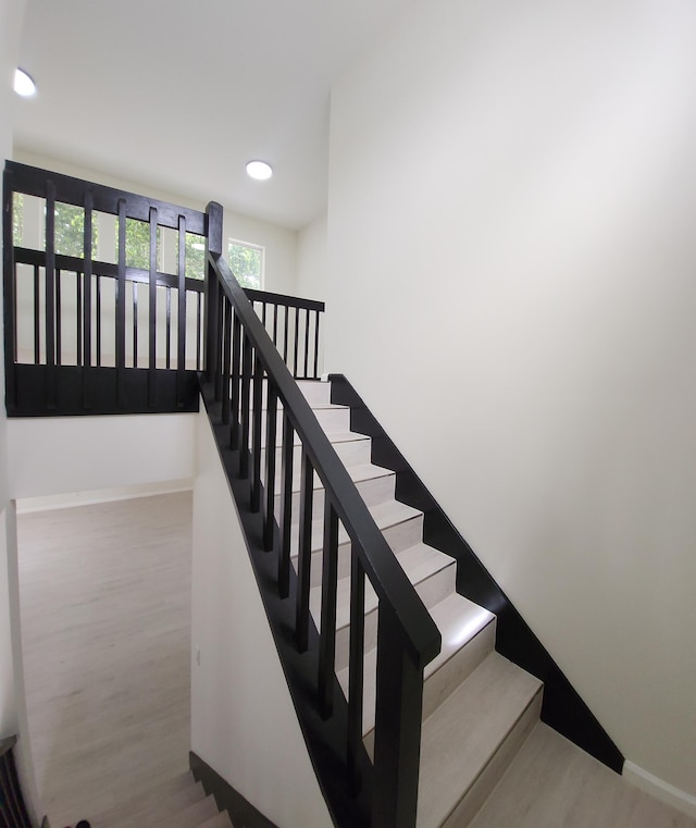 2012 White Coral Ct, Wellington, FL 33414 - staircase featuring wood finished floors, baseboards, and recessed lighting
