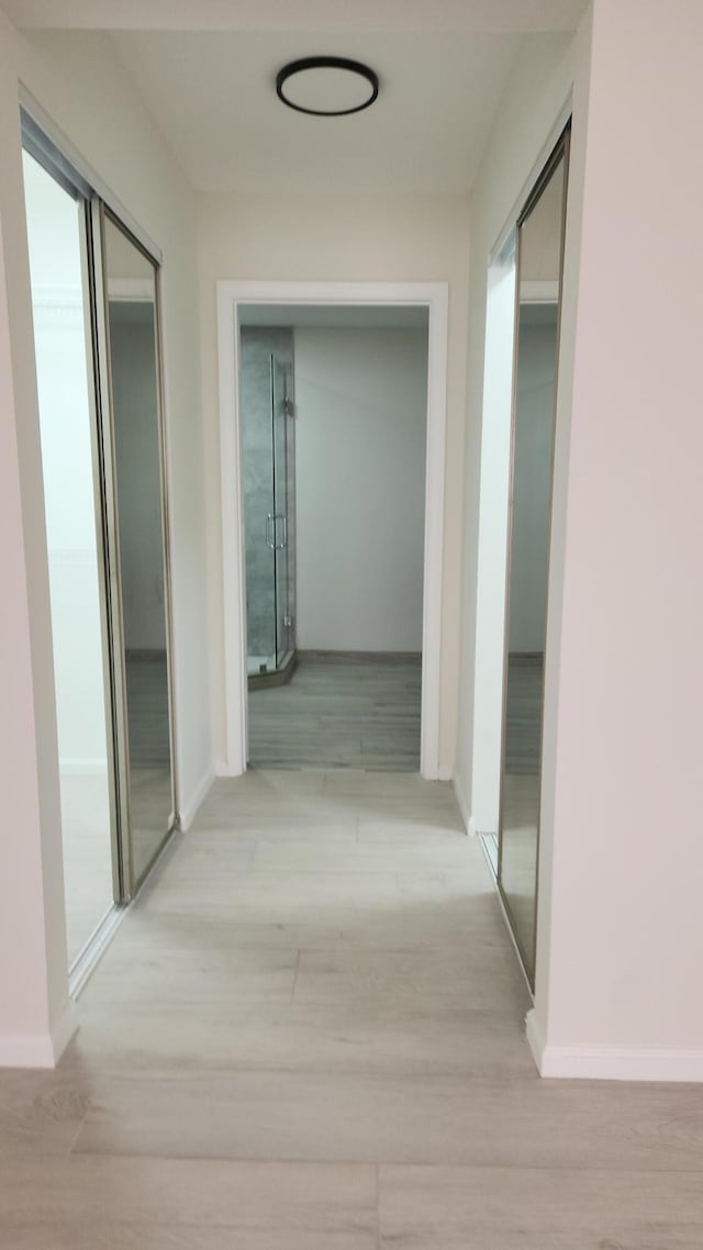 2012 White Coral Ct, Wellington, FL 33414 - hall with light wood-type flooring and baseboards