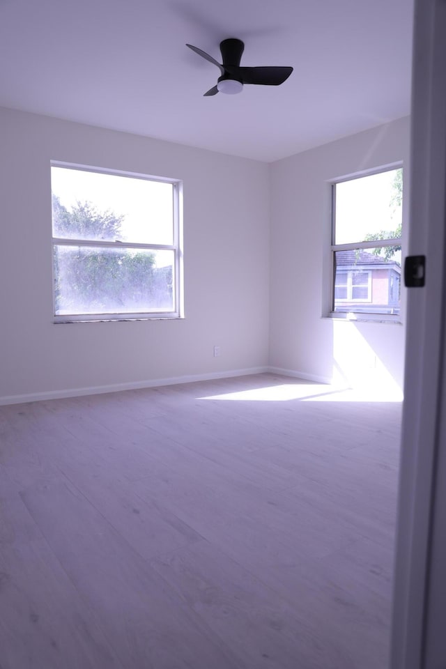 2012 White Coral Ct, Wellington, FL 33414 - unfurnished room with plenty of natural light, ceiling fan, and baseboards