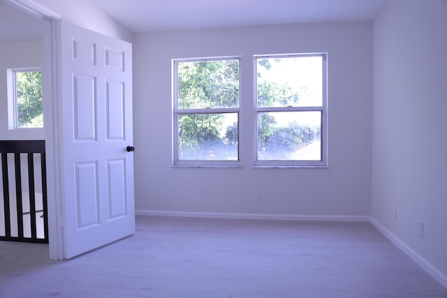 2012 White Coral Ct, Wellington, FL 33414 - spare room featuring baseboards and light wood-style floors