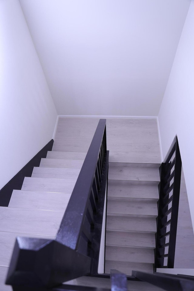 2012 White Coral Ct, Wellington, FL 33414 - staircase featuring baseboards