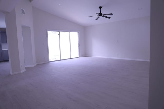 2012 White Coral Ct, Wellington, FL 33414 - empty room with vaulted ceiling, baseboards, a ceiling fan, and light wood-style floors