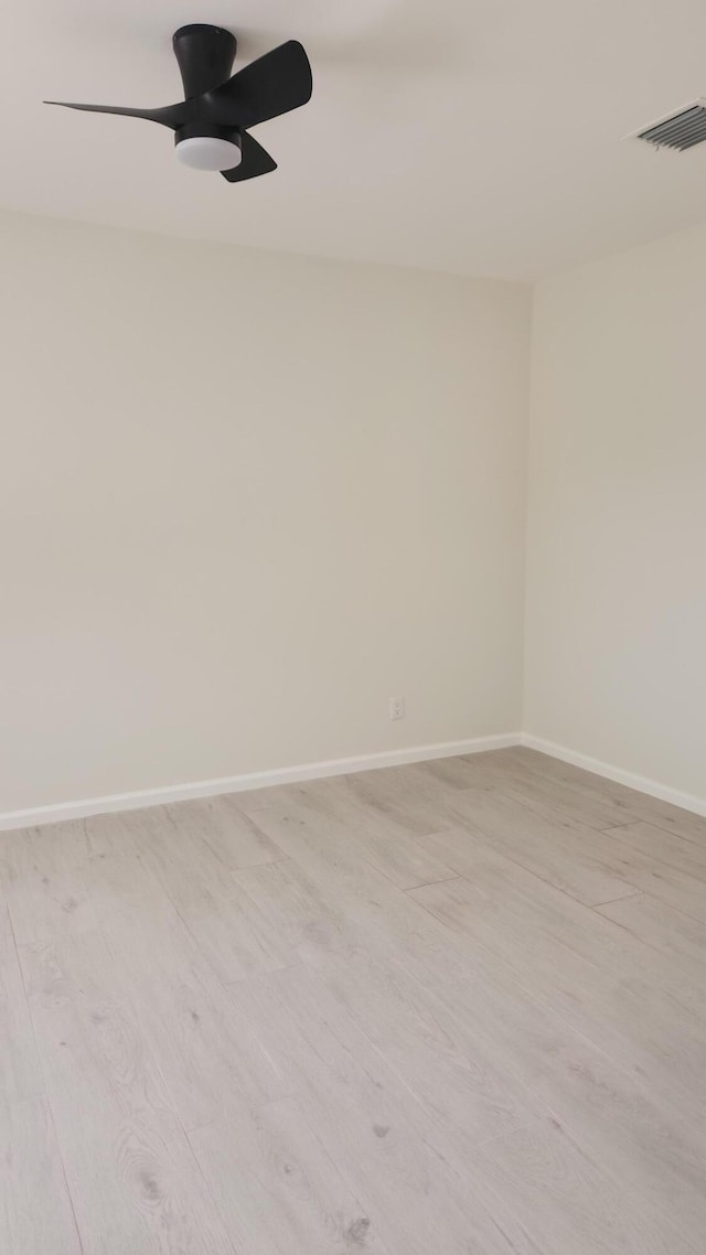 2012 White Coral Ct, Wellington, FL 33414 - spare room with light wood-style flooring, baseboards, and a ceiling fan