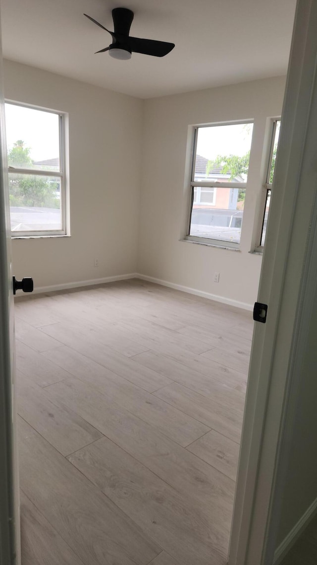 2012 White Coral Ct, Wellington, FL 33414 - spare room with a ceiling fan, baseboards, and wood finished floors