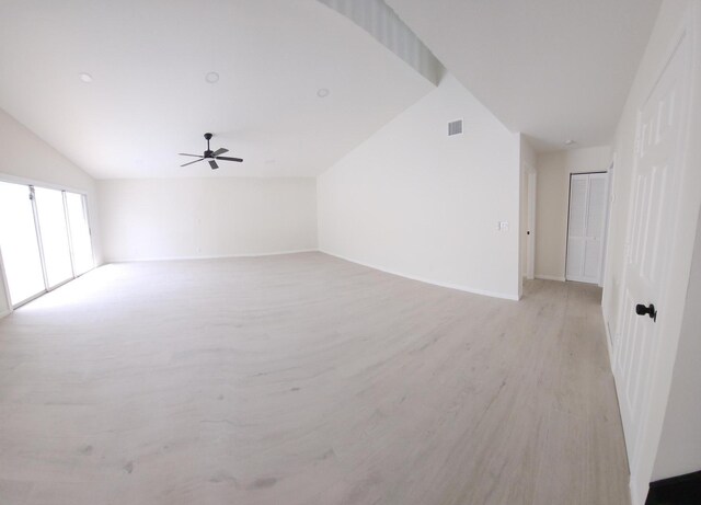 2012 White Coral Ct, Wellington, FL 33414 - unfurnished living room with lofted ceiling, a ceiling fan, and light wood finished floors