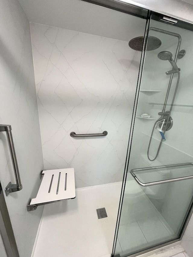 308 Golfview Rd Unit 107, North Palm Beach, FL 33408 - bathroom with a marble finish shower