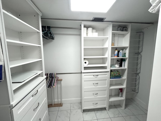 308 Golfview Rd Unit 107, North Palm Beach, FL 33408 - spacious closet featuring light marble finish flooring