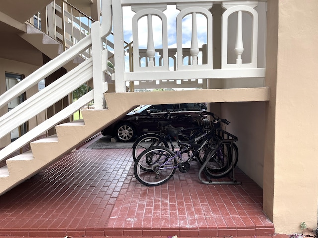 308 Golfview Rd Unit 107, North Palm Beach, FL 33408 - stairs featuring brick flooring