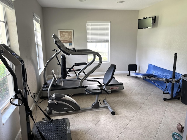 308 Golfview Rd Unit 107, North Palm Beach, FL 33408 - exercise area with plenty of natural light and baseboards