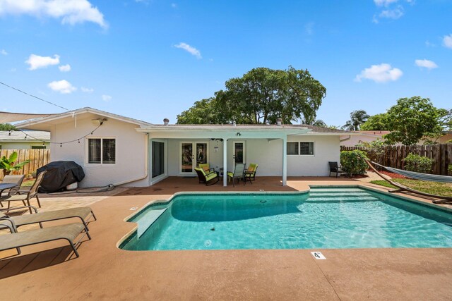 513 Curlew Rd, Delray Beach, FL 33444 - view of swimming pool featuring a patio area and grilling area