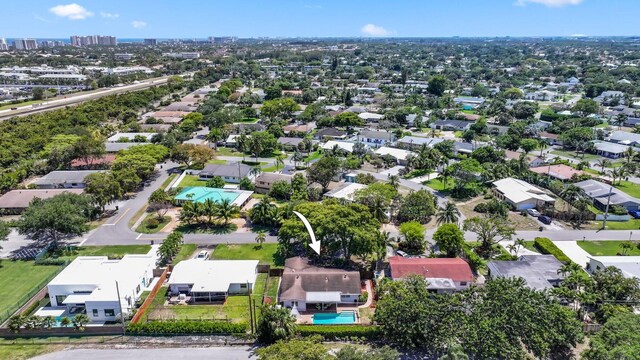 513 Curlew Rd, Delray Beach, FL 33444 - aerial perspective of suburban area with a pool