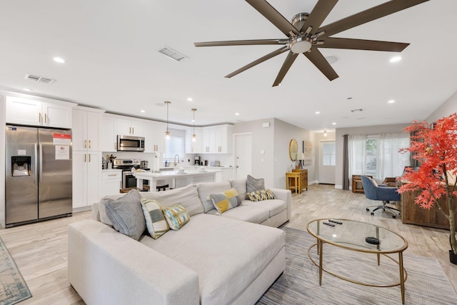 513 Curlew Rd, Delray Beach, FL 33444 - living area featuring light wood-style flooring, plenty of natural light, recessed lighting, and a ceiling fan