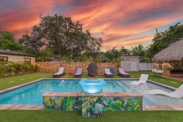 1646 NE 3rd Ave, Delray Beach, FL 33444 - pool at dusk with a gazebo and a putting area