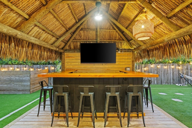 1646 NE 3rd Ave, Delray Beach, FL 33444 - indoor bar with lofted ceiling, hardwood / wood-style flooring, wood walls, and wood ceiling