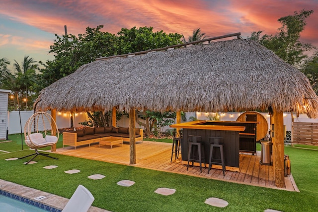 1646 NE 3rd Ave, Delray Beach, FL 33444 - yard at dusk featuring a gazebo, an outdoor living space, and a deck