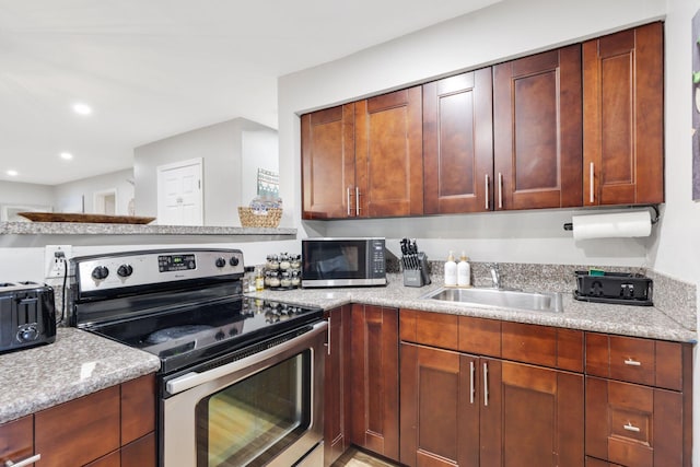 1646 NE 3rd Ave, Delray Beach, FL 33444 - kitchen with appliances with stainless steel finishes, a sink, and recessed lighting
