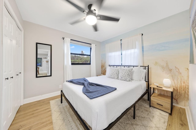 1646 NE 3rd Ave, Delray Beach, FL 33444 - bedroom with light wood finished floors, a closet, baseboards, and ceiling fan