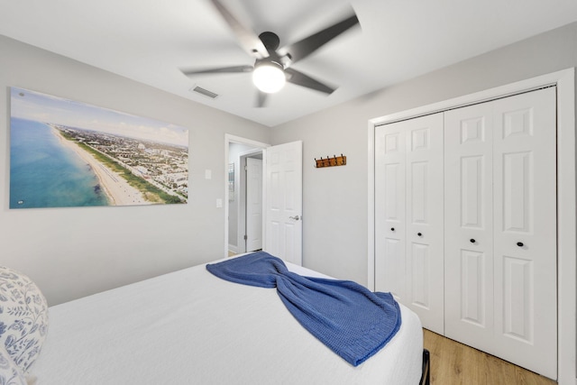1646 NE 3rd Ave, Delray Beach, FL 33444 - bedroom with light wood-style floors, a closet, and a ceiling fan