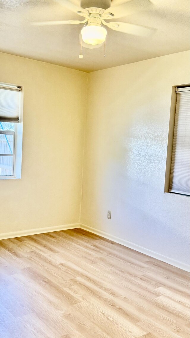 629 Troy Blvd, West Palm Beach, FL 33409 - empty room featuring light wood-style flooring, a ceiling fan, and baseboards
