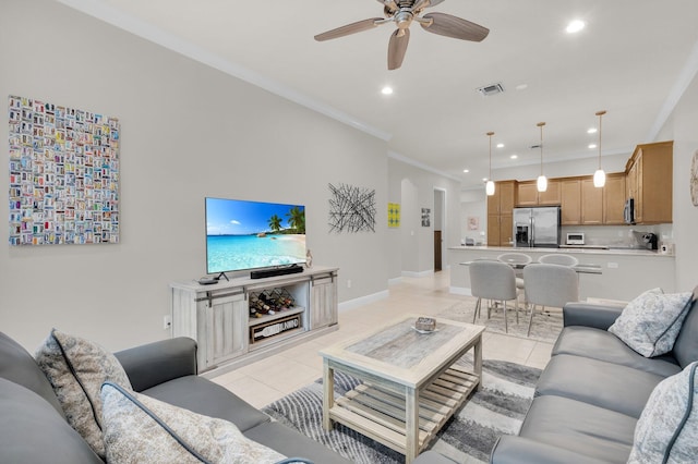14811 Via Porta, Delray Beach, FL 33446 - living area featuring ceiling fan, light tile patterned floors, recessed lighting, ornamental molding, and baseboards