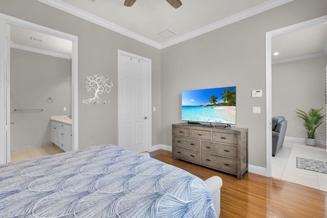 14811 Via Porta, Delray Beach, FL 33446 - bedroom with crown molding, baseboards, light wood finished floors, ensuite bath, and ceiling fan