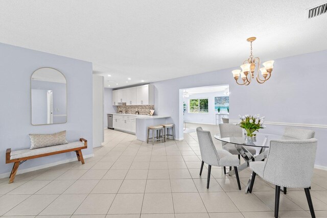 3187 Buccaneer Rd, Lake Worth, FL 33462 - dining space with a chandelier, baseboards, recessed lighting, and light tile patterned floors