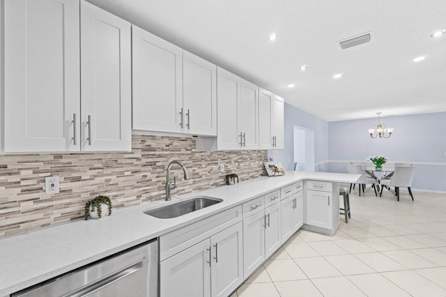 3187 Buccaneer Rd, Lake Worth, FL 33462 - kitchen featuring a sink, dishwasher, light countertops, backsplash, and recessed lighting