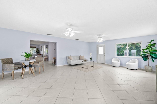 3187 Buccaneer Rd, Lake Worth, FL 33462 - living area featuring baseboards, a ceiling fan, and light tile patterned floors