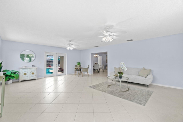 3187 Buccaneer Rd, Lake Worth, FL 33462 - sitting room with a ceiling fan, french doors, light tile patterned flooring, and baseboards