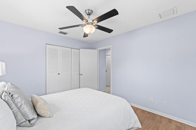 3187 Buccaneer Rd, Lake Worth, FL 33462 - bedroom featuring light wood finished floors, baseboards, a closet, and a ceiling fan