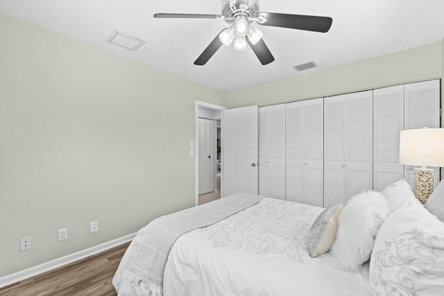 3187 Buccaneer Rd, Lake Worth, FL 33462 - bedroom with baseboards, wood finished floors, and ceiling fan