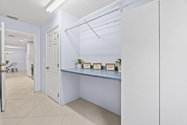 3187 Buccaneer Rd, Lake Worth, FL 33462 - hall with light tile patterned flooring and a textured ceiling