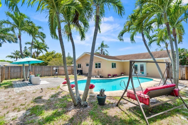 3187 Buccaneer Rd, Lake Worth, FL 33462 - view of swimming pool featuring french doors, a patio area, and a fenced backyard