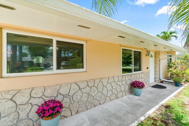 3187 Buccaneer Rd, Lake Worth, FL 33462 - view of exterior entry with stone siding and stucco siding