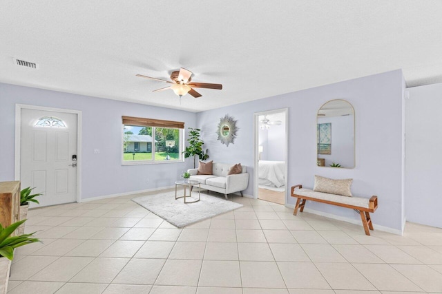 3187 Buccaneer Rd, Lake Worth, FL 33462 - entrance foyer featuring ceiling fan, baseboards, and light tile patterned floors